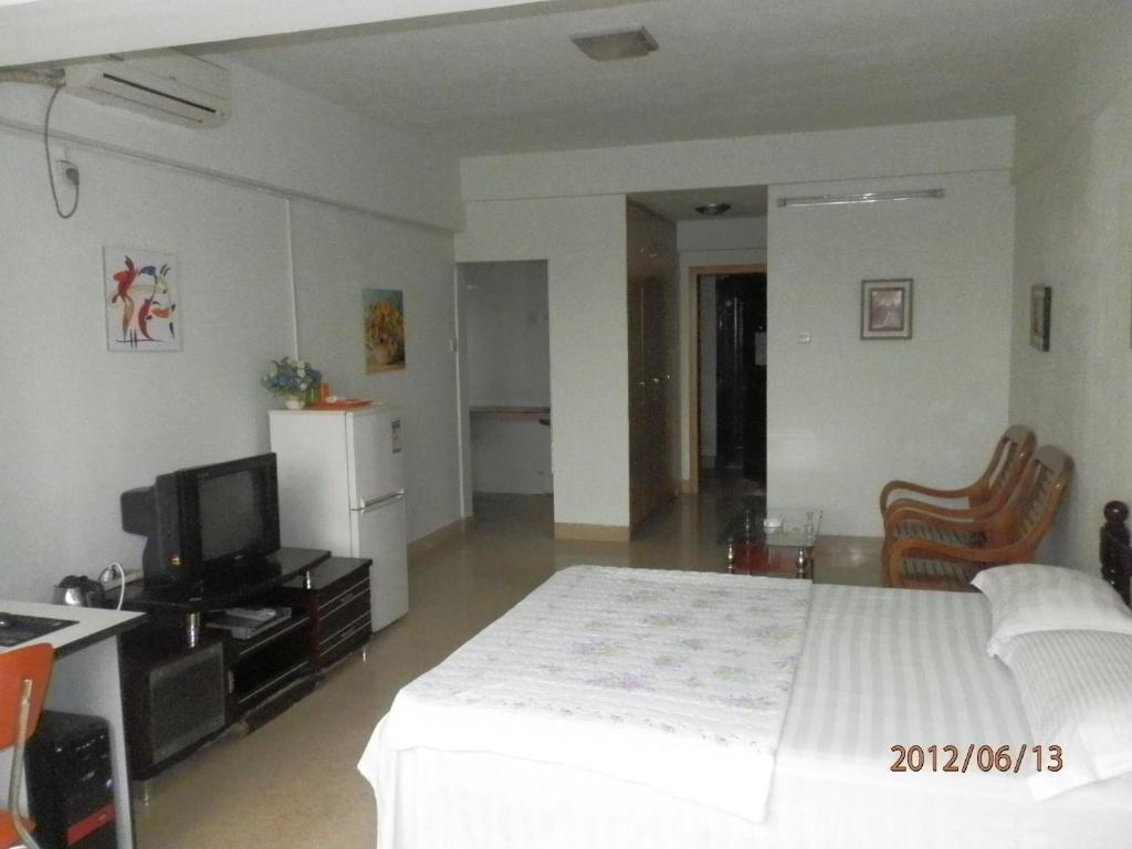Xingfu Hotel Nanning Zimmer foto