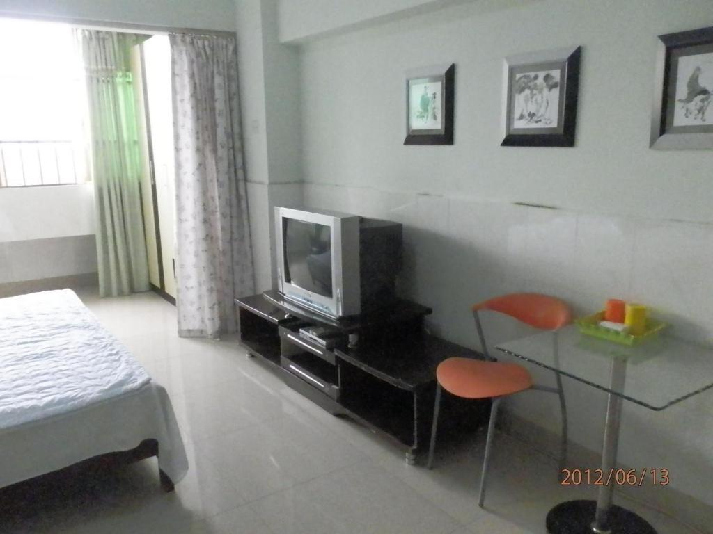 Xingfu Hotel Nanning Zimmer foto